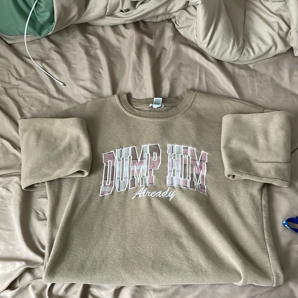 Rue21. Tan with pink and white in the writing.